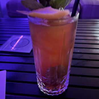The Rooftop at The Graham - Roosevelt Island cocktail with Bourbon, Vodka, lemon juice, iced tea, mint - Cocktail Bars Near Me - Washington, DC, District of Columbia The Rooftop at The Graham - Roosevelt Island cocktail with Bourbon, Vodka, lemon juice, iced tea, mint - Cocktail Bars Near Me - Washington, DC, District of Columbia