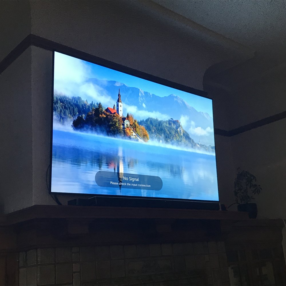 Photo of tv mounted on wall. Photo of tv mounted on wall.