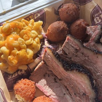 Sweet Lew’s BBQ - Collard Greens Mac and Cheese brisket hush puppies - Barbeque Near Me - Charlotte, North Carolina Sweet Lew’s BBQ - Collard Greens Mac and Cheese brisket hush puppies - Barbeque Near Me - Charlotte, North Carolina