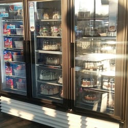 Dairy Queen / Orange Julius - Refrigerated dessert case with ice cream bars, ice cream cakes and fudgesicles.