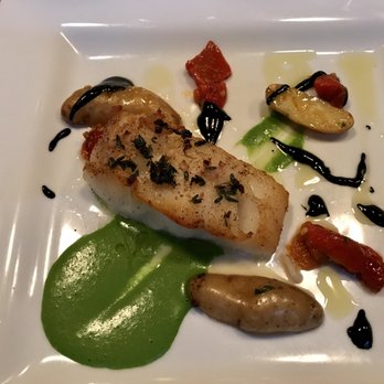 Good Luck Restaurant - Broiled white fish with pea puree, fingerling potatoes and squid ink reduction - New American Near Me - Rochester, New York