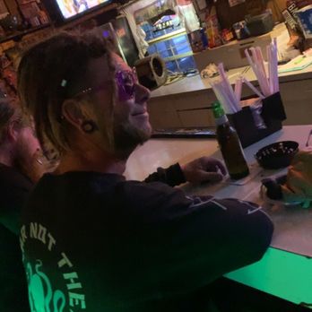 Boardwalk Tavern - a man with dreadlocks sitting at a bar - Dive Bars Near Me - Lealman, Florida Boardwalk Tavern - a man with dreadlocks sitting at a bar - Dive Bars Near Me - Lealman, Florida