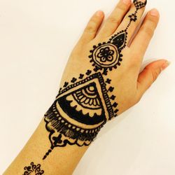 Amazing Eyebrows & Henna Designs - Black henna design done on a client