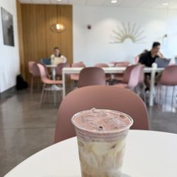 Primo Passo Coffee - Double shot of espresso, house-made cherry syrup, milk, and a cherry cold foam dusted with sakura powder