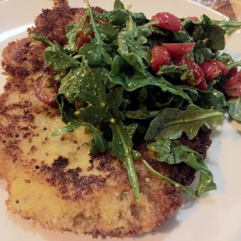 Rennick Meat Market - Pork schnitzel accompanied with tomatoes and arugula in a light dressing - Steakhouses Near Me - Ashtabula, Ohio