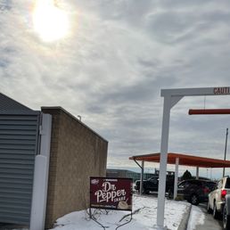 a car parked in front of a gas station
