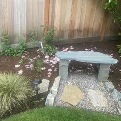 Ore-Green Gardening - Stone bench seating area simple yet elegant.