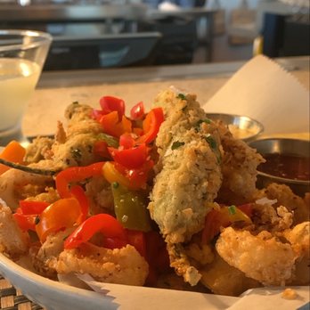 Pacific Table - Fried calamari Edith fried peppers with fried olives busting out with mild salty favor. Amazing dish for happy hour as well .. - Seafood Near Me - Irving, Texas