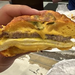 Jalapeño cheddar bagel with sausage egg and cheese. Jalapeño cheddar bagel with sausage egg and cheese.