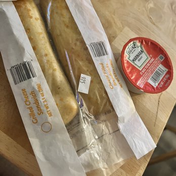 Kwik Trip - two sausages wrapped in paper on a table - Gas Stations Near Me - DeForest, Wisconsin