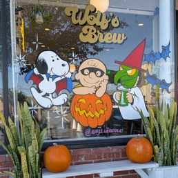 Snoopy and Charlie Brown on the glass window for Halloween.