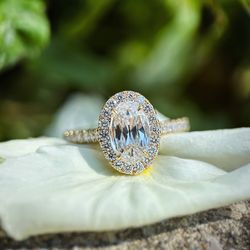Bromberg's & - Oval halo engagement ring in yellow gold.