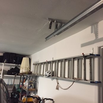 US Pro Remodelers - a view of a garage with a ladder - General Contractors Near Me - Buffalo Grove, Illinois