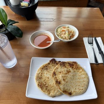 Los Molcajetes - Two original pupusas revueltas, tomato salsa, curtido. - Salvadoran Near Me - Los Angeles, California Los Molcajetes - Two original pupusas revueltas, tomato salsa, curtido. - Salvadoran Near Me - Los Angeles, California