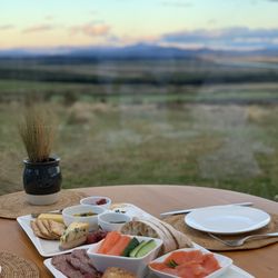 SkyScape - Antipasto dinner for two $85 NZD. Good quality cheese, meats, crackers, and bread. Very indulging and satisfying.