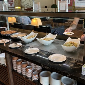 Turkish Airlines Lounge - Buffet bar which featured hit entrees like tomato bisque, stewed chicken, flavored rice. Also had hummus and pita bread, pasta salad - Airport Lounges Near Me - Dulles, Virginia