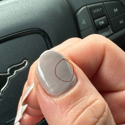 Pit in the polish. Uneven shaping; too much filed off on the left. Pit in the polish. Uneven shaping; too much filed off on the left.
