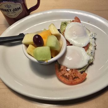 Honey Jam Cafe - Avocado Toast with Poached Eggs and fruit. - Breakfast & Brunch Near Me - Downers Grove, Illinois Honey Jam Cafe - Avocado Toast with Poached Eggs and fruit. - Breakfast & Brunch Near Me - Downers Grove, Illinois