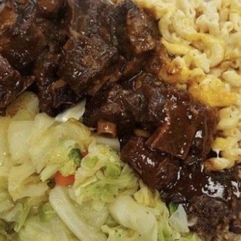 Jerk Masters - In this photo is cabbage, oxtails, and mac & cheese Delicious well seasoned - Caribbean Near Me - Raleigh, North Carolina Jerk Masters - In this photo is cabbage, oxtails, and mac & cheese Delicious well seasoned - Caribbean Near Me - Raleigh, North Carolina