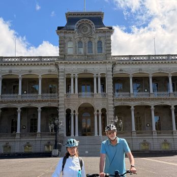 Iolani Palace - Iolani Palace with Bike Tour guests visiting the grounds - Museums Near Me - Honolulu, Hawaii