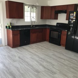 a kitchen with black appliances