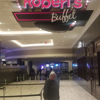 Robert's Buffet - A person is standing in front of the Robert's Buffet sign inside a shopping mall or hotel lobby area. - Buffets Near Me - Riverside, Iowa