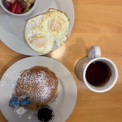 Fruit cup, one pancake, two eggs, hot tea