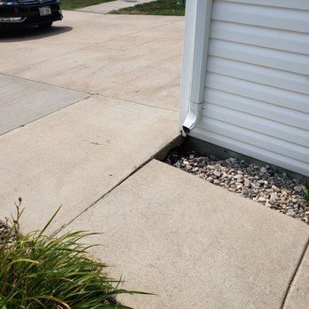Chuck's Sandjacking - Water causes settling. Could use a extension on down spout. - Masonry/Concrete Near Me - Fargo, North Dakota Chuck's Sandjacking - Water causes settling. Could use a extension on down spout. - Masonry/Concrete Near Me - Fargo, North Dakota