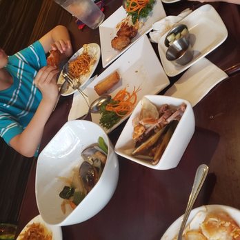 Ditmars Thai - Steamed mussel,pineapple rice ,Pad Thai Noodles,Combo Appetizer chicken dumplings & many more on this table - Thai Near Me - Astoria, New York Ditmars Thai - Steamed mussel,pineapple rice ,Pad Thai Noodles,Combo Appetizer chicken dumplings & many more on this table - Thai Near Me - Astoria, New York