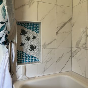 SMART Plumbing Hawaii - Art work insert with Honu (sea turtles) tile work, and shower curtain for walk- in tub. - Plumbing Near Me - Hilo, Hawaii SMART Plumbing Hawaii - Art work insert with Honu (sea turtles) tile work, and shower curtain for walk- in tub. - Plumbing Near Me - Hilo, Hawaii