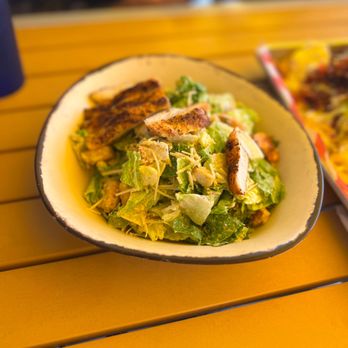 LandShark Bar & Grill - Miami Bayside - a plate of salad and a pizza - Bars Near Me - Miami, Florida