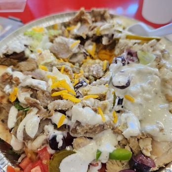 The Halal Guys - a plate of food on a table - Mediterranean Near Me - Southlake, Texas The Halal Guys - a plate of food on a table - Mediterranean Near Me - Southlake, Texas