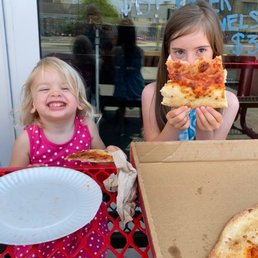My girls enjoying a Pepperoni Pizza Slice My girls enjoying a Pepperoni Pizza Slice