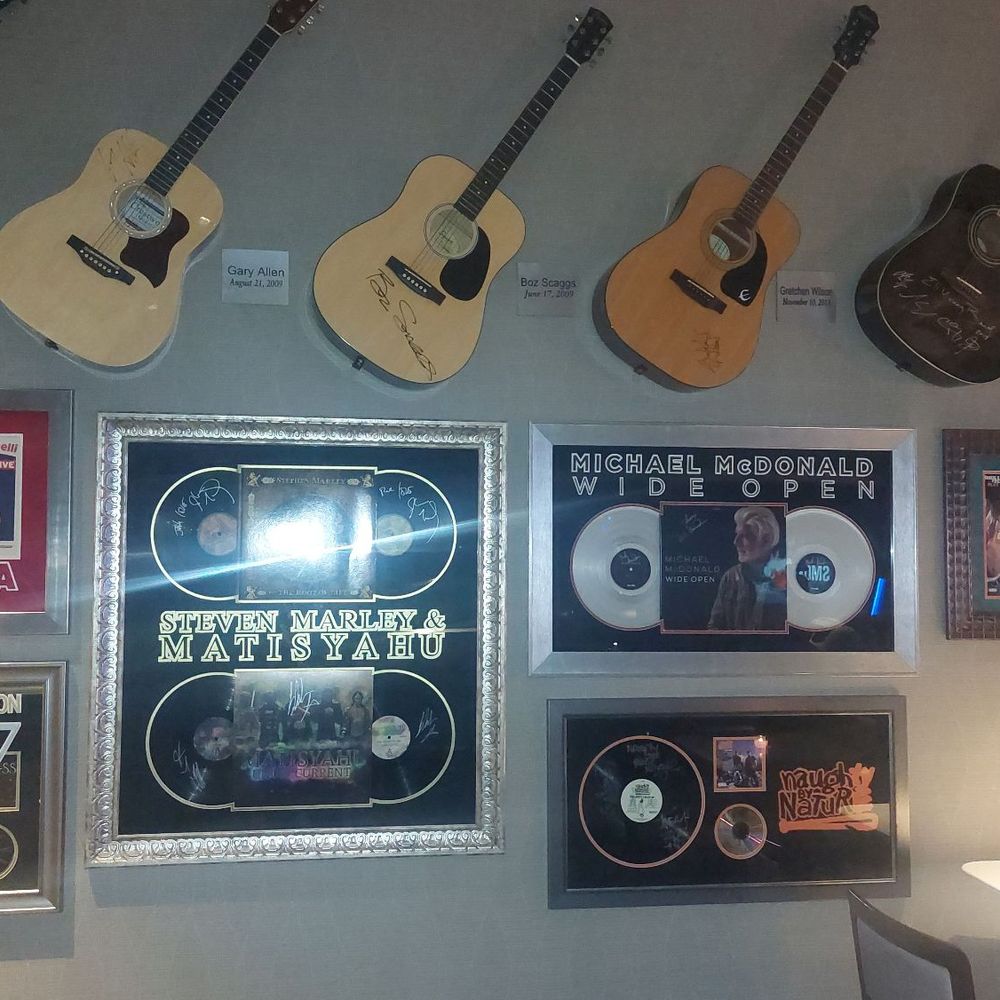 Sound Board - Autographed guitars and picture frames from celebrities in the dining room with the open bar - Music Venues Near Me - Detroit, Michigan Sound Board - Autographed guitars and picture frames from celebrities in the dining room with the open bar - Music Venues Near Me - Detroit, Michigan