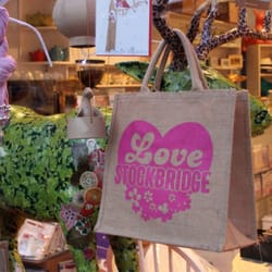 Kiss The Fish - 'Love Stockbridge' jute bags on display in Kiss the Fish.