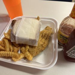 Three filet plate with 2 pieces of white bread.