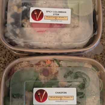 Vibrant Fork - Picture of two Vibrant Fork meals in rectangular packaging. They are labeled "Spicy Columbian Stew" and "Chaofàn." - Food Delivery Services Near Me - San Diego, California Vibrant Fork - Picture of two Vibrant Fork meals in rectangular packaging. They are labeled "Spicy Columbian Stew" and "Chaofàn." - Food Delivery Services Near Me - San Diego, California