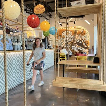 Taco Love - The tables have swing seating. - Tacos Near Me - Davie, Florida Taco Love - The tables have swing seating. - Tacos Near Me - Davie, Florida