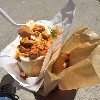 Fetty's Street Food - Bunny Chow (chicken curry in a loaf of bread) and an Indian Samosa. - Food Trucks Near Me Fetty's Street Food - Bunny Chow (chicken curry in a loaf of bread) and an Indian Samosa. - Food Trucks Near Me