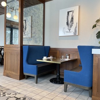 La Voya Brasserie - a blue booth with two blue chairs - French Near Me - Saint Paul, Minnesota La Voya Brasserie - a blue booth with two blue chairs - French Near Me - Saint Paul, Minnesota