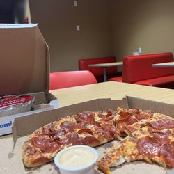 Domino's Pizza - Pepperoni pizza with extra pepperoni, clean store interior