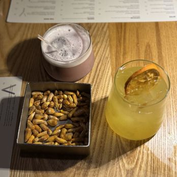 Yunta Nikkei - Complimentary corn nuts. Sangria and vodka drink - Peruvian Near Me - Charlotte, North Carolina Yunta Nikkei - Complimentary corn nuts. Sangria and vodka drink - Peruvian Near Me - Charlotte, North Carolina