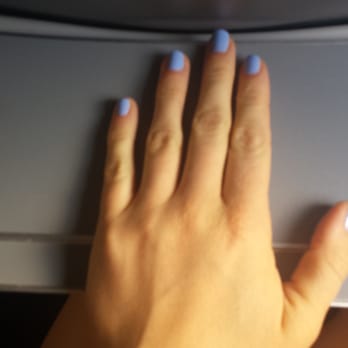 Frontier Airlines - My lady hand on the miniature tray table - Airlines Near Me - Denver, Colorado