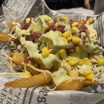 Caracas Bistro - Llanera Fries - the best loaded fries ever! Steak, bacon, cheese, corn, avocado, cheese, and the awesome green sauce - Venezuelan Near Me - Mishawaka, Indiana Caracas Bistro - Llanera Fries - the best loaded fries ever! Steak, bacon, cheese, corn, avocado, cheese, and the awesome green sauce - Venezuelan Near Me - Mishawaka, Indiana