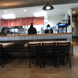 Poco Loco Mexican Grill - Seating, menu, ordering counter.