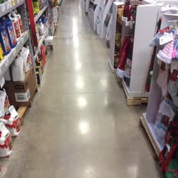 Lowe's Home Improvement - Baby clothes kept right next to poison. Probably not the best idea.