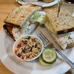 Chicken salad sandwich, pickles, quinoa + bean salad.