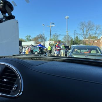 7 Brew Coffee - Employees in Hawaiian shirts and tents with lots of t shirts. - Coffee & Tea Near Me - Kingsport, Tennessee