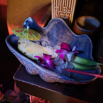 Three Dots and A Dash - Royal Hawaiian. Also super good. Would take a regular tiki mug over this vessel even though it's fun at first! - Asian Fusion Near Me - Chicago, Illinois Three Dots and A Dash - Royal Hawaiian. Also super good. Would take a regular tiki mug over this vessel even though it's fun at first! - Asian Fusion Near Me - Chicago, Illinois