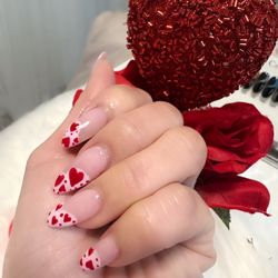 Love n the air with our valentines theme nail art from our nail technician.